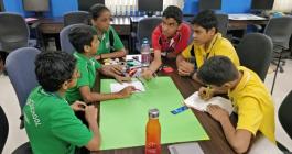 students working in groups to solve problems