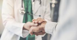 doctor shaking hands with patient 