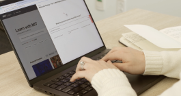 Hands typing a laptop with the MIT Learn homepage shown