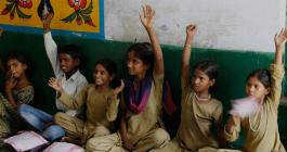 children raising their hands