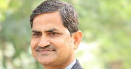 Headshot of Mohammad Imran Khan Mewati with trees in background