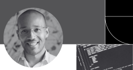 Headshot photo of George Whitfield against an abstract background.