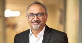 Bearded man in glasses and business casual attire