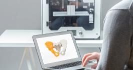 Person using generative design application to design a prosthetic hip joint. 