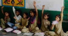 students raising their hands