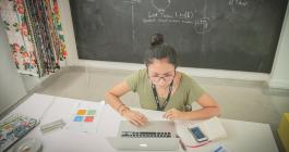 woman at a desk on her laptop