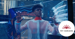 Photo image from the Blank Panther movie of Shuri, who is dressed in protective gear as she works on a screen in her laboratory. MIT Horizon logo is in the corner.