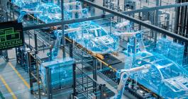 Photo of a car factory with a digital automated robot arm assembly line superimposed over it.