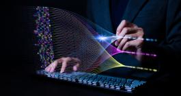 Photo of hands behind a keyboard with illustration of a generative artificial intelligence large language model above.