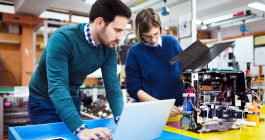 two people looking at a computer 