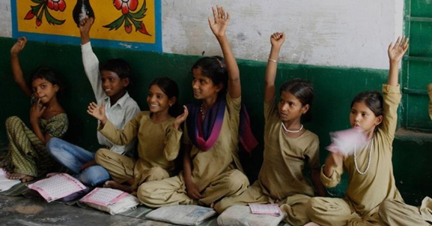 students raising their hands