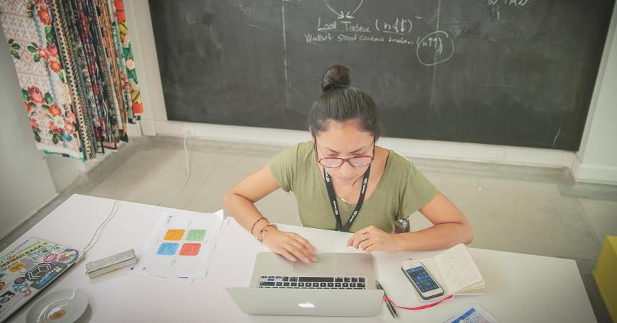 woman at a desk on her laptop