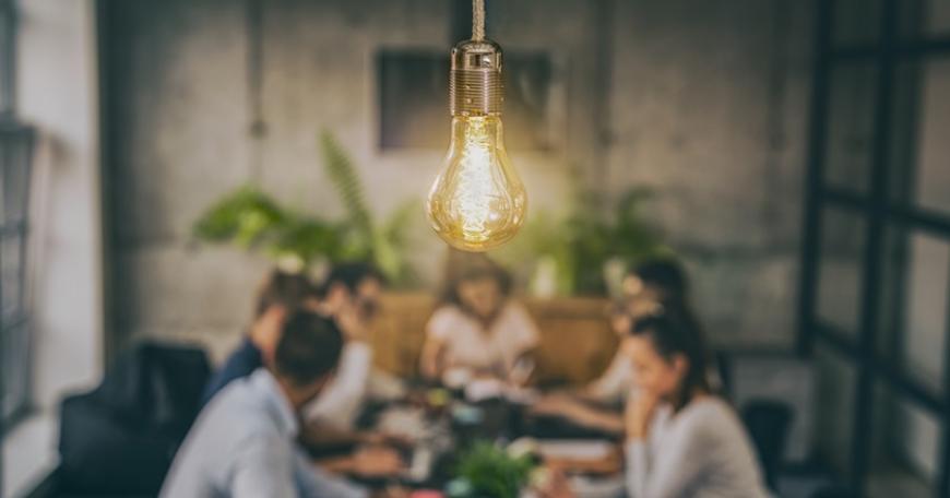people sitting at a table having a discussion 