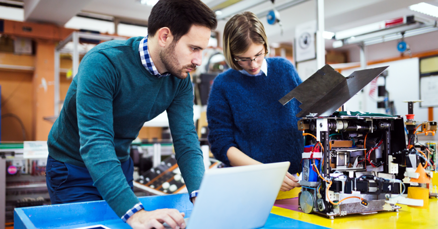 two people looking at a computer 