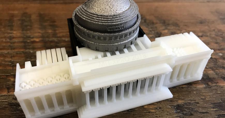A new online course from MIT and Boeing uses a 3-D-printed kit to enrich the learning experience. Similar to a textbook, the kit is used as a reference throughout the course. The kit has metal and polymer parts made by industry-relevant 3-D-printing processes, including stereolithography, multi-jet fusion, and direct metal laser sintering. The parts interlock to form a model of MIT's iconic Building 10 dome.