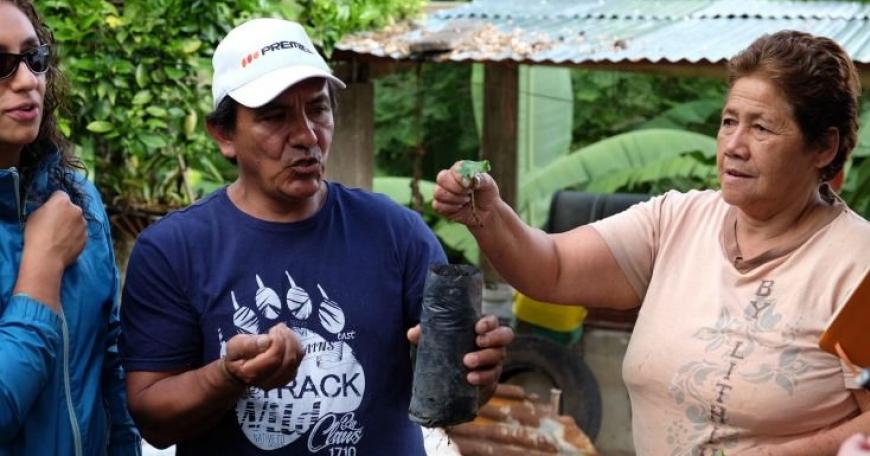 Colombian farmers demonstrate the coffee-growing process to D-Lab students.