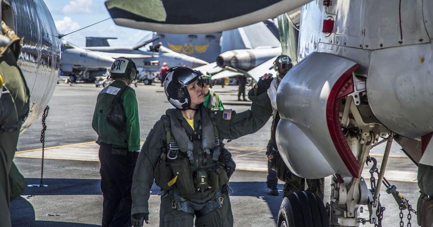 The U.S. Naval Air Systems Command views a shift to model-based systems engineering as an essential step in shortening and modernizing its abilities to deliver high-quality, state-of-the-art programs. Pictured here is Cmdr. Cynthia Dieterly, commanding officer of Carrier Airborne Early Warning Squadron 115 conducts pre-flight checks on an E-2C Hawkeye prior to launch from the Nimitz-class aircraft carrier USS George Washington.
