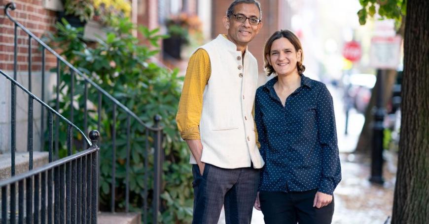 MIT economists Abhijit Banerjee and Esther Duflo stand outside their home after learning that they have been named co-winners of the 2019 Nobel Prize in economic sciences. They will share the prize with Michael Kremer of Harvard University.