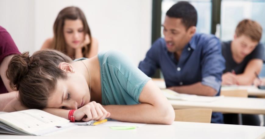 student sleeping at desk