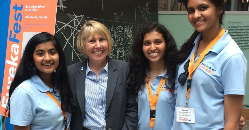  Leigh Estabrooks (second from left) stands with South Brunswick High School InvenTeam members at EurekaFest 2015.
