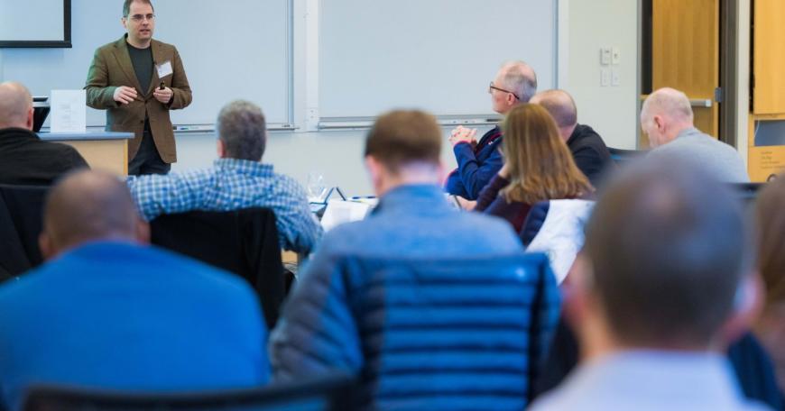 Professor Aleksander Madry delivers a lecture as part of the Artificial Intelligence for National Security Leaders (AI4NSL) program. The three-day program educates leaders who may not have a technical background on the basics of AI, machine learning, and data science, and how these topics intersect with national security. 