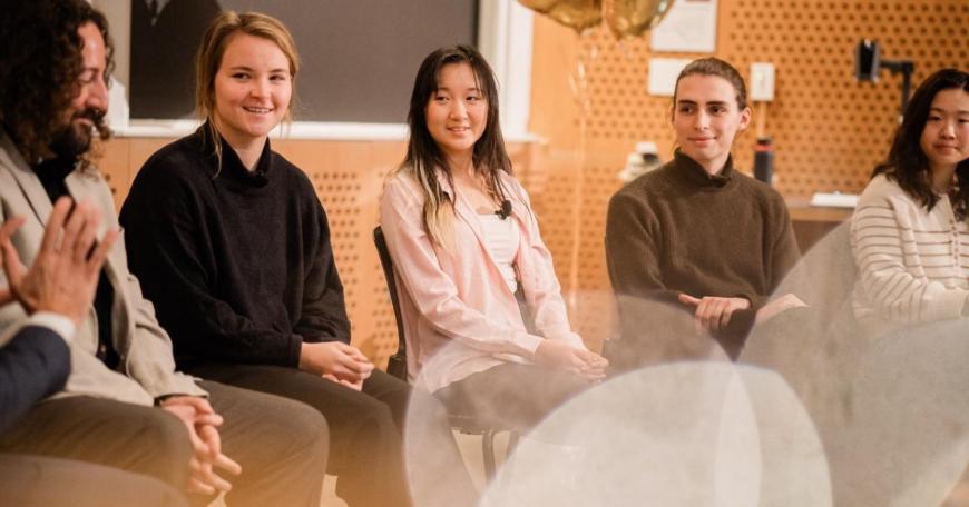 Panelists (left to right) Joe Diaz ’11, graduate student Rachael Harkavy, undergraduate Joyce Yuan, visiting student Lancelot Blanchard, and graduate student Grace Song look toward moderator Ian Waitz as they discuss how they use generative AI in school and work.