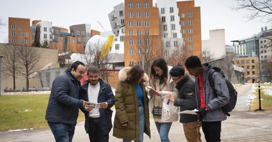 Students in the 2023 DEDP master’s cohort gather on MIT’s campus.