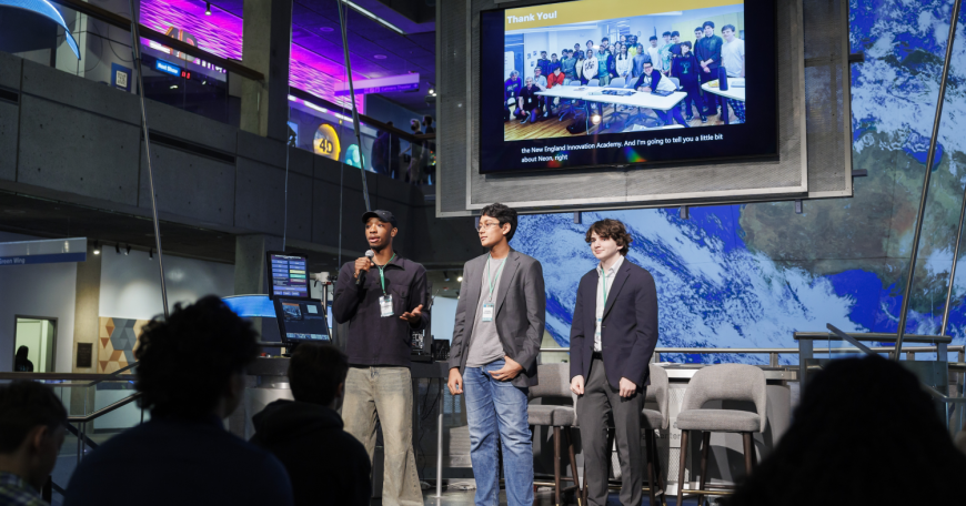 Langston Reid, Vishnu Bharath, and Simon Zall (left to right) discuss their project at the 2024 Day of AI global celebration at the Museum of Science. Day of AI is a free, hands-on curriculum developed by the MIT Responsible AI for Social Empowerment and Education (RAISE) initiative.
