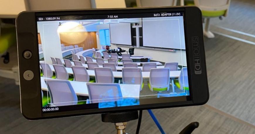 Photo of a camera screen displaying a lecture hall.