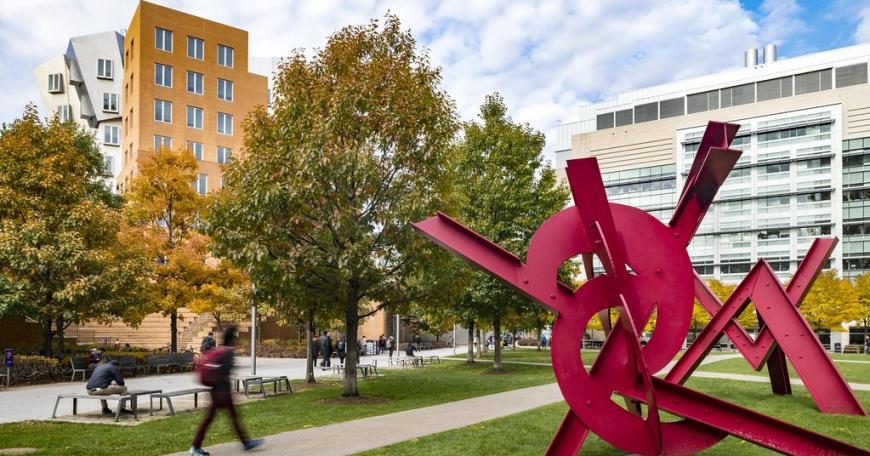 MIT campus with abstract sculpture in foreground and Stata Center in background