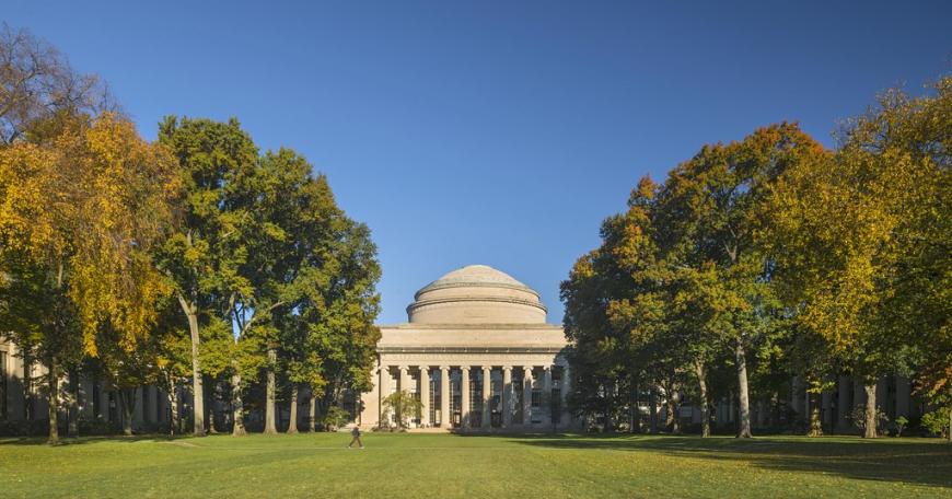 MIT great dome surrounded by trees with Killian court in the foreground