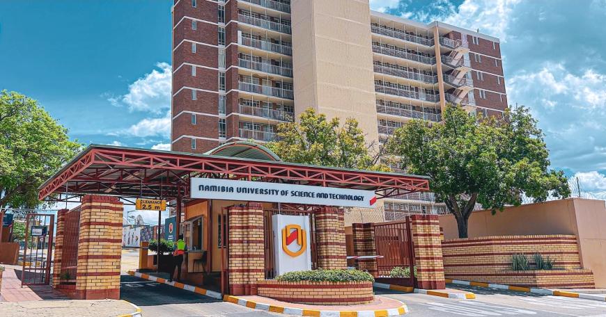 Front gates of the Namibian University of Science and Technology. The name of the university is on the gates