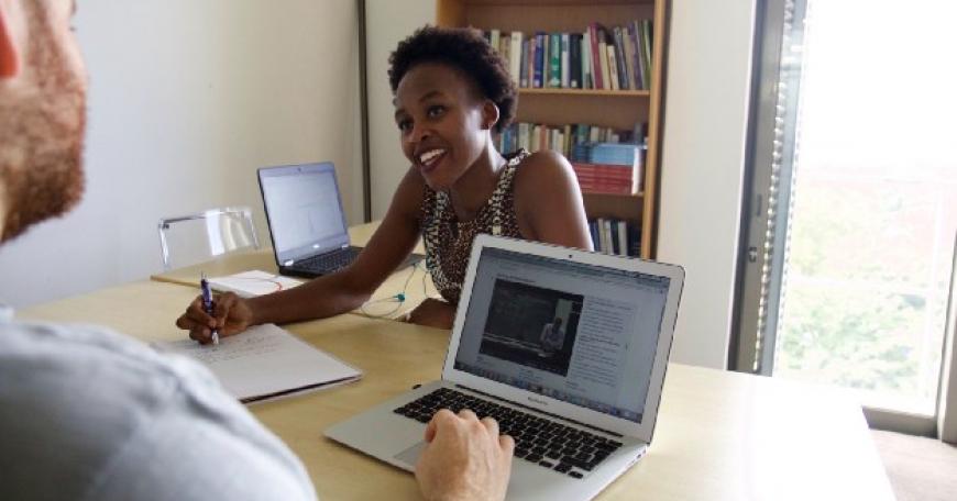 J-PAL Africa staff Palesa Thinta and Lloyd Belton review MicroMasters material in Cape Town, South Africa. Photo: Aimee Hare | J-PAL