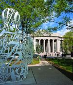 "The Alchemist" by Jaume Plensa sits on the campus of MIT