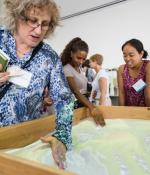 People earning about the AR Sandbox