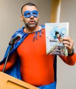 Shawn Robinson, senior research associate at the University of Wisconsin at Madison, helped kick off the first-ever MIT Science of Reading event dressed in full superhero attire as Doctor Dyslexia Dude — the star of a graphic novel series he co-created to engage and encourage young readers, rooted in his own experiences as a student with dyslexia. 