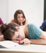 student sleeping at desk