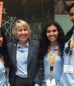  Leigh Estabrooks (second from left) stands with South Brunswick High School InvenTeam members at EurekaFest 2015.