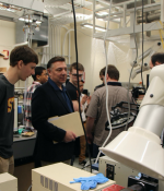 Students and faculty from Springfield Technical Community College visit an MIT lab before the Covid-19 pandemic.