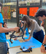 In January 2020, MIT student Irene Terpstra (center, leaning over table) taught a week-long robotics workshop to 11th and 12th graders at CIC Escola de Batxillerats in Barcelona through the GTL Spain Program. 