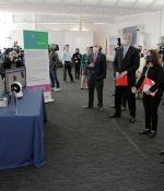 MIT Schwarzman College of Computing Dean Daniel Huttenlocher, Massachusetts Governor Charlie Baker, Lieutenant Governor Karen Polito, Secretary of Education James Peyser, MIT President L. Rafael Reif, and Vertex Pharmaceuticals Executive Chairman Jeff Leiden observe a demonstration by PhD student Daniella DiPaola about Jibo, the social robot.