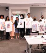 Cambridge Mayor Sumbul Siddiqui visits the Mayor's Summer Youth Employment Program (MSYEP) learning site at MIT while students worked on T-shirts that imagined how data science could be used to support marginalized communities. Left to right: Yusuf Solomon, Zeynep Yalcin, Olivia Dias, Raechel Walker, Cynthia Breazeal, Siddiqui, Jacob G., Jacob T., Lisa, Jesmin, Nina, Kiki, and Neko.