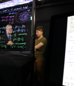 MIT Professor Martin Bazant (left) and Joey Gu, lecturer and digital learning scientist, discuss lecture content for filming at MIT’s Lightboard studio.
