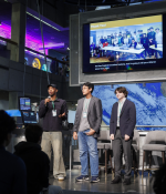 Langston Reid, Vishnu Bharath, and Simon Zall (left to right) discuss their project at the 2024 Day of AI global celebration at the Museum of Science. Day of AI is a free, hands-on curriculum developed by the MIT Responsible AI for Social Empowerment and Education (RAISE) initiative.