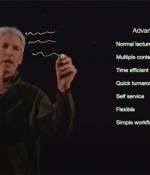 Jim Cain writing on transparent lightboard