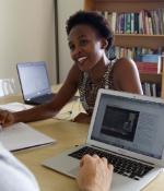 J-PAL Africa staff Palesa Thinta and Lloyd Belton review MicroMasters material in Cape Town, South Africa. Photo: Aimee Hare | J-PAL