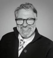 Headshot of Gus Zahariadis smiling 