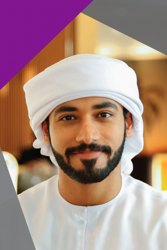 Headshot of a man wearing a turban.